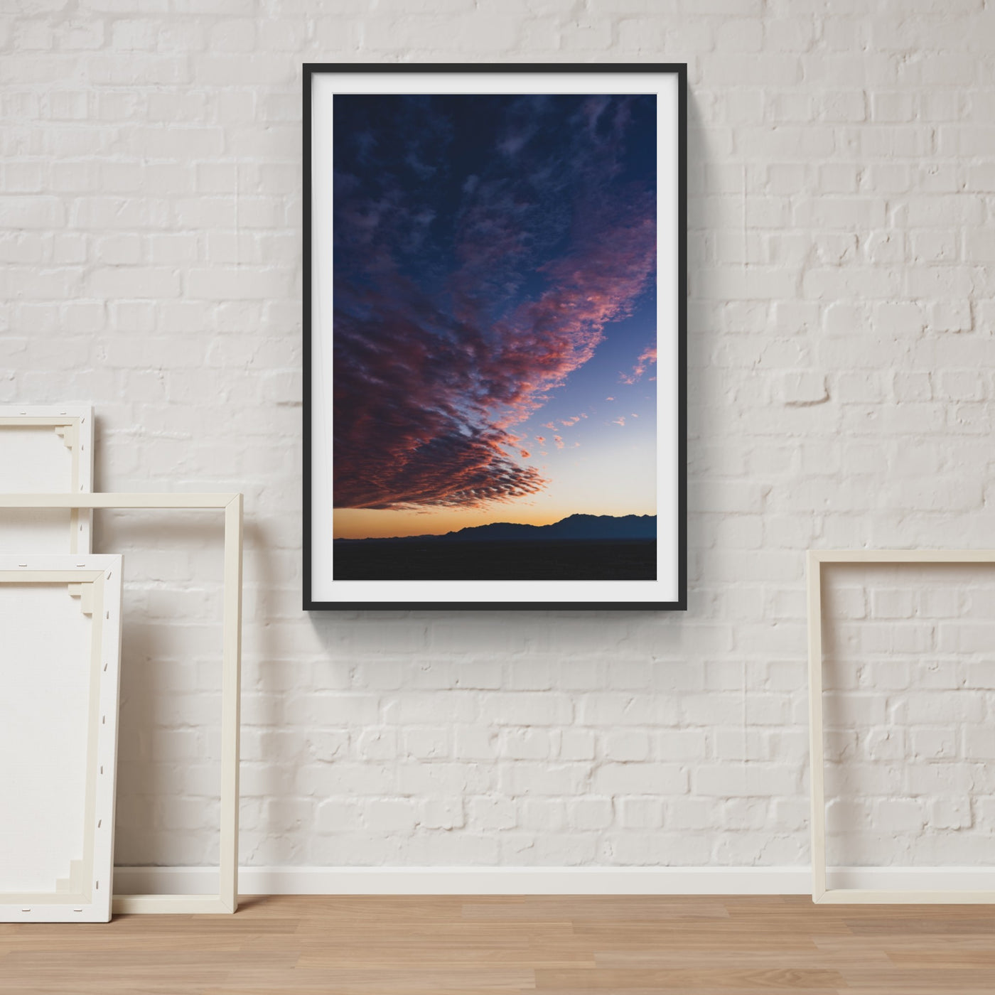 Dramatic colored sunset photograph on wall