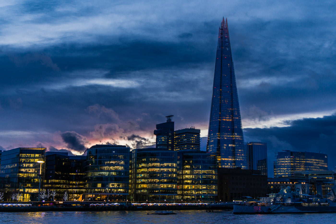 The Shard building in London, England with blue and purple sunset