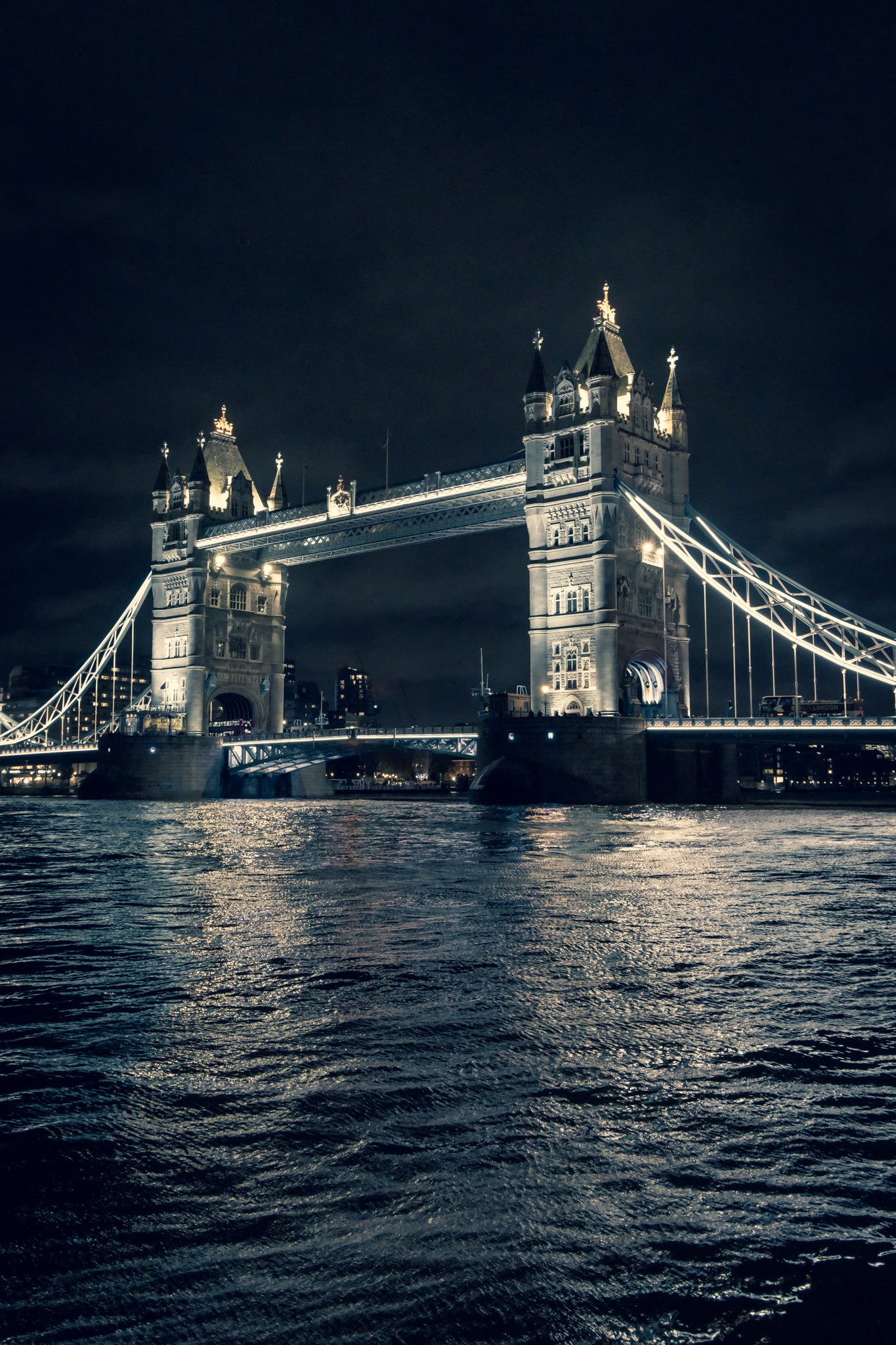 London Tower Bridge at night above the water