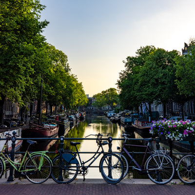 Amsterdam canal with bikes on bridge
