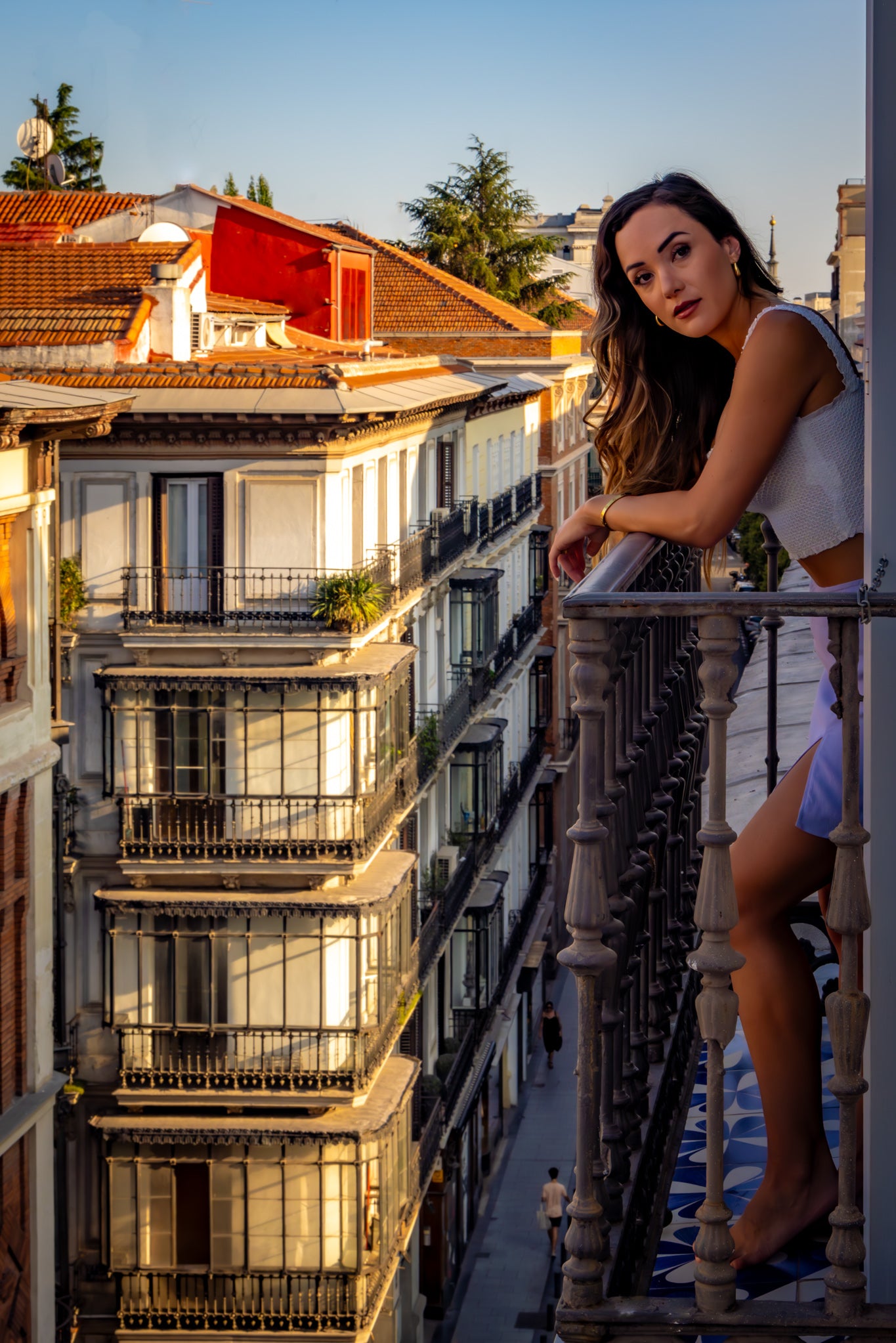 Girl leaning over balcony