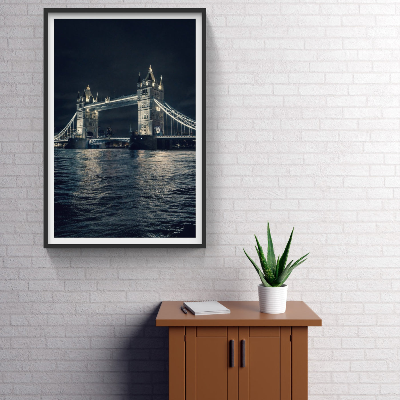 London Tower Bridge at night above the water photo hanging on white wall